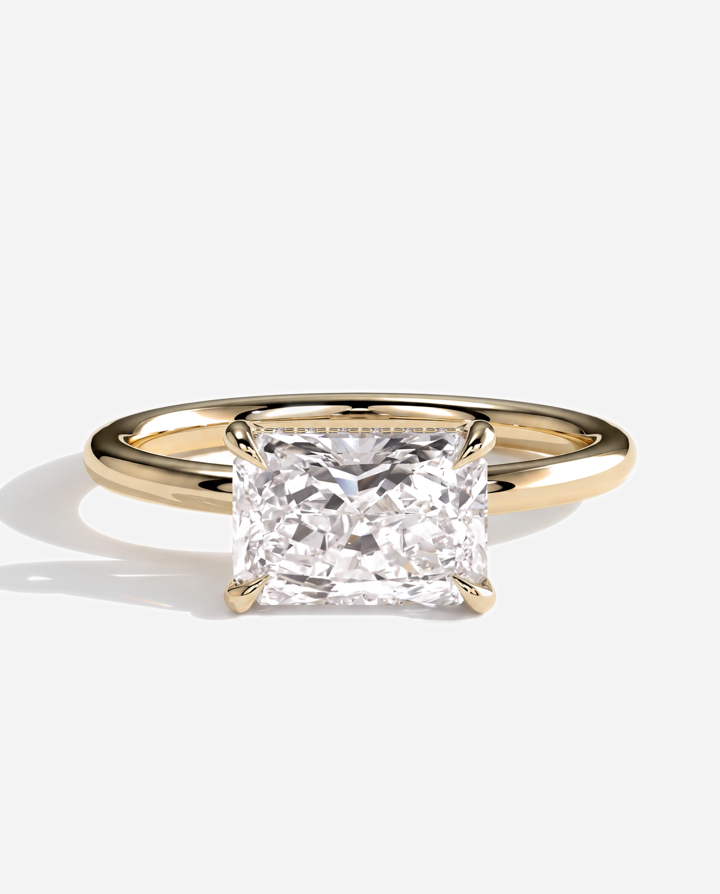 Tamsin Radiant East West Claw Solitaire with Hidden Halo Engagement Ring, lab grown diamond in yellow gold, front view