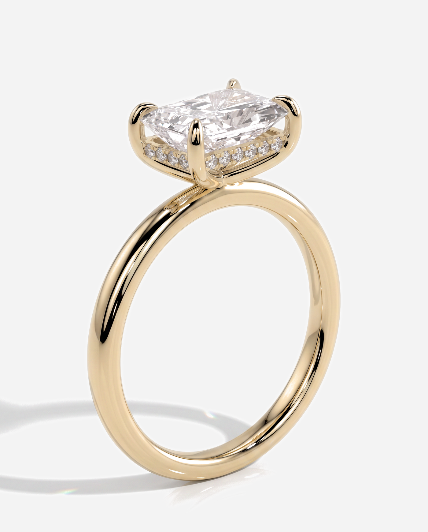 Tamsin Radiant East West Claw Solitaire with Hidden Halo Engagement Ring, lab grown diamond in yellow gold, three quarter view