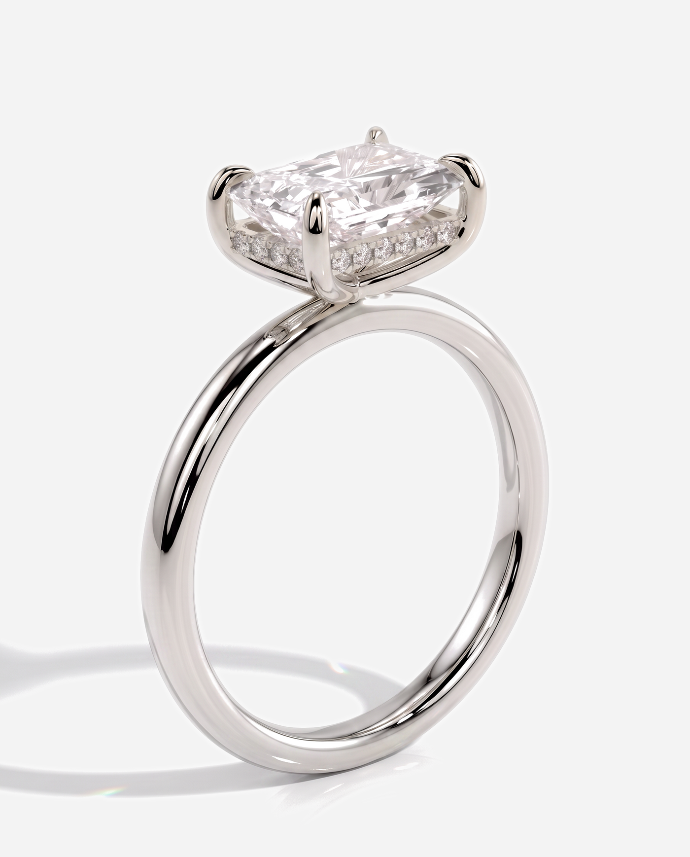 Tamsin Radiant East West Claw Solitaire with Hidden Halo Engagement Ring, lab grown diamond in white gold, three quarter view