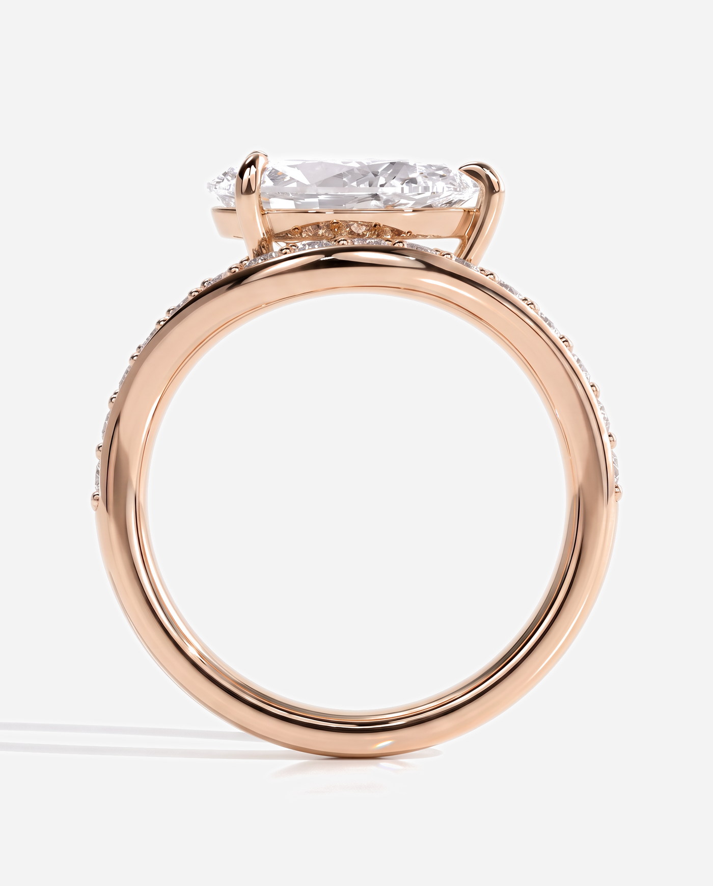 Ellis Pear Claw Solitaire with Bead Set Pave Wave Band and East West Setting Engagement Ring, lab grown diamond in rose gold, side profile