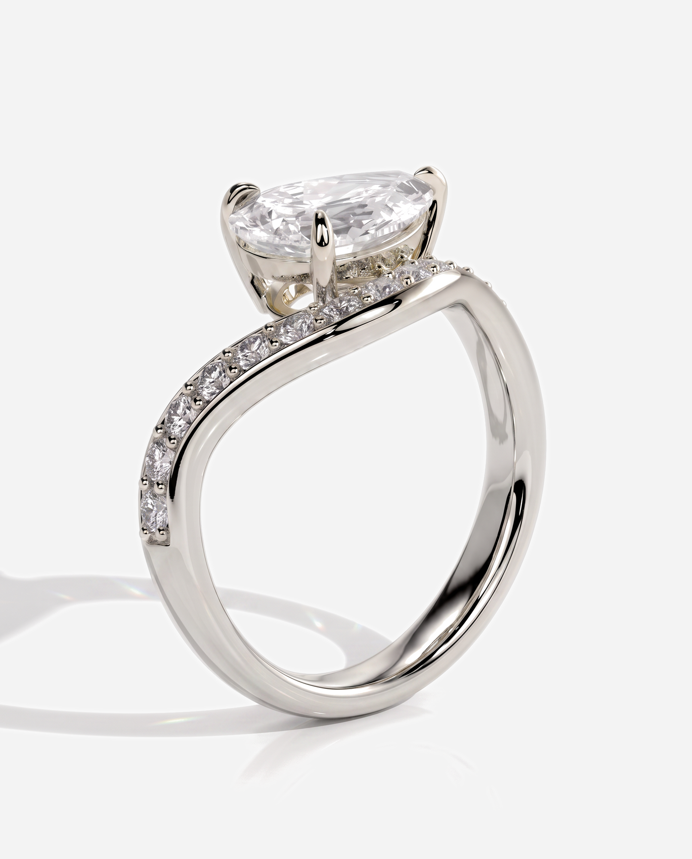 Ellis Pear Claw Solitaire with Bead Set Pave Wave Band and East West Setting Engagement Ring, lab grown diamond in platinum, three quarter view