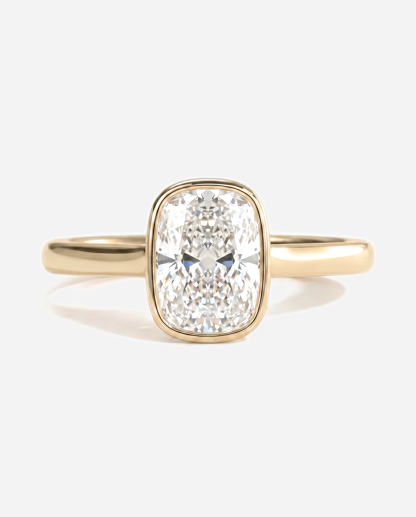 Tatum Elongated Cushion Bezel Solitaire with Cathedral Setting Engagement Ring, lab grown diamond in yellow gold, front view