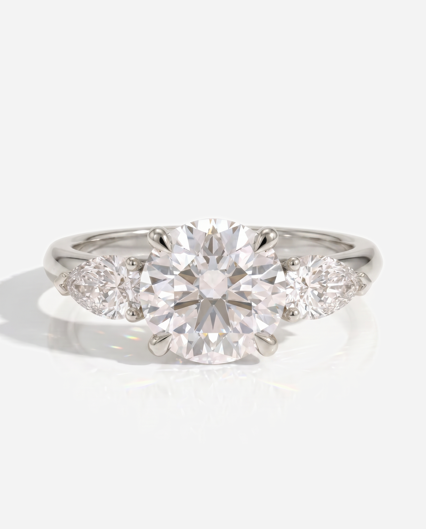 Alyssa Round Claw Trilogy with Pear Side Stones and Knife Edge Band Engagement Ring, lab grown diamond in white gold, front view