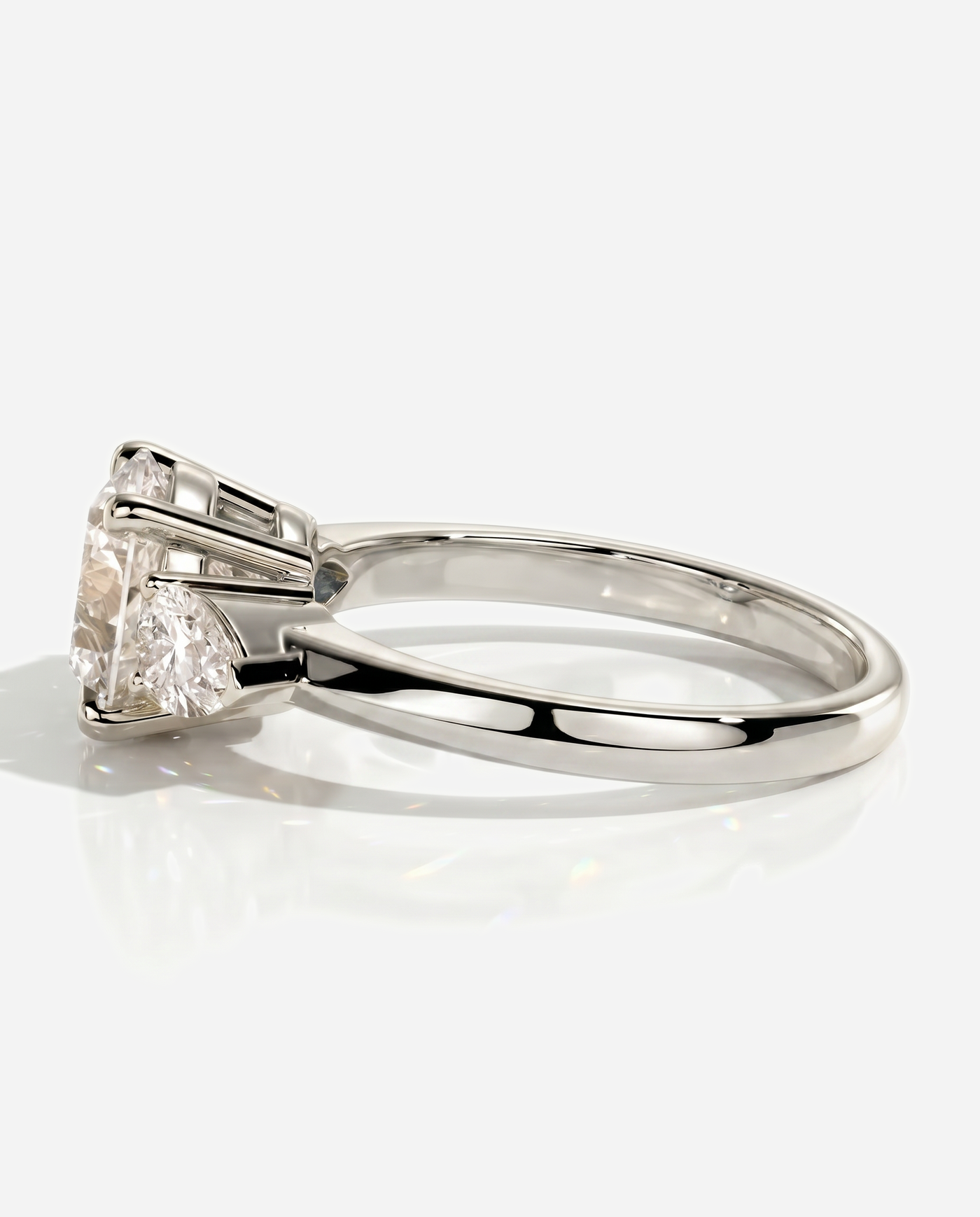 Alyssa Round Claw Trilogy with Pear Side Stones and Knife Edge Band Engagement Ring, lab grown diamond in platinum, detail view