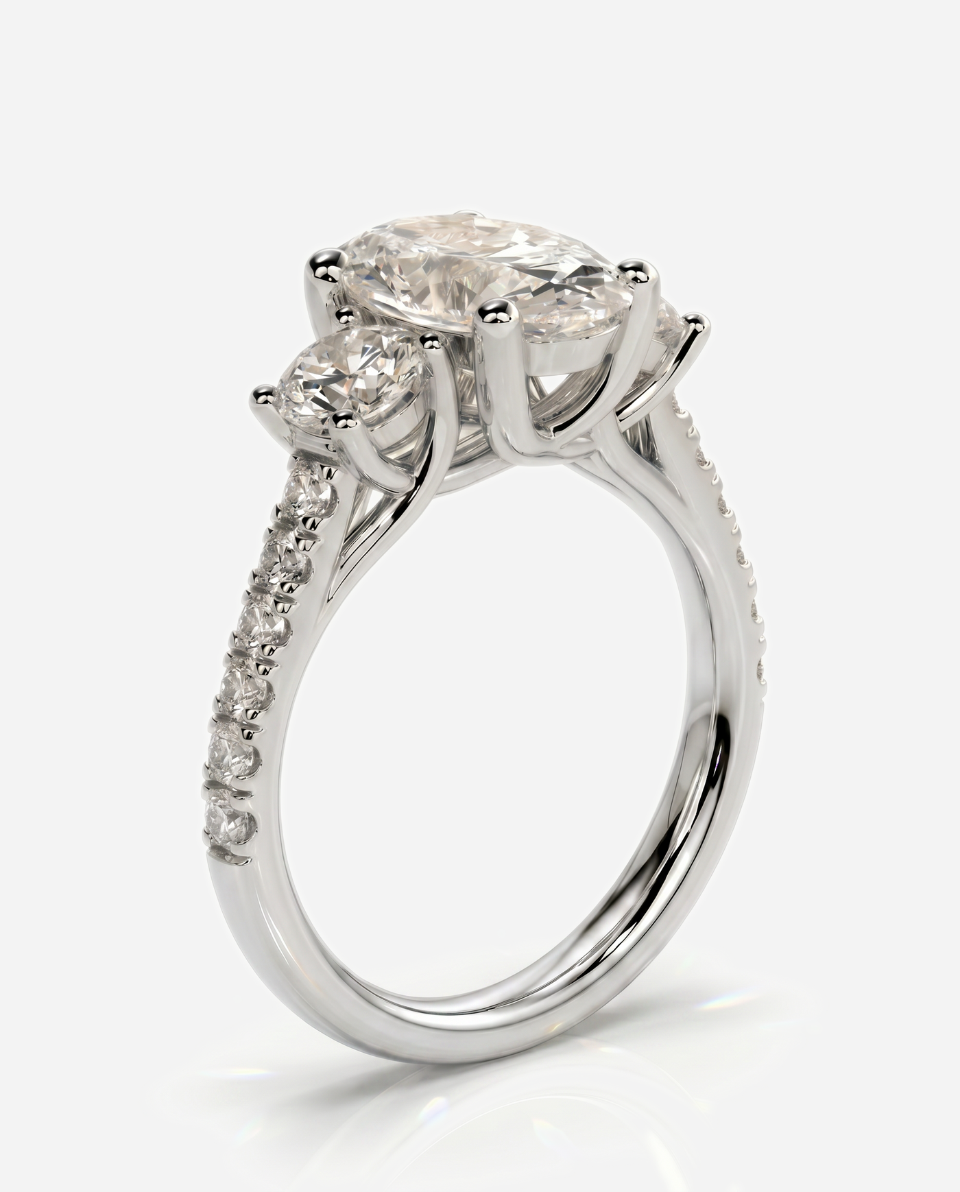 Hazel Oval Claw Trilogy with Round Side Stones, Pave Band and Trellis Gallery Engagement Ring, lab grown diamond in white gold, three quarter view