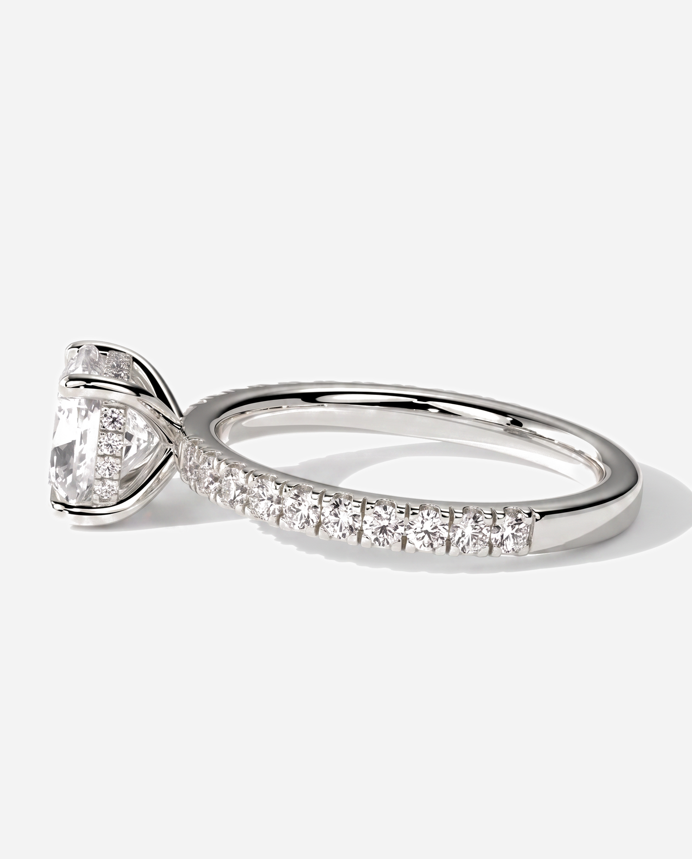 Cadence Cushion Claw Solitaire with Hidden Halo and Pave Band Engagement Ring, lab grown diamond in platinum, detail view