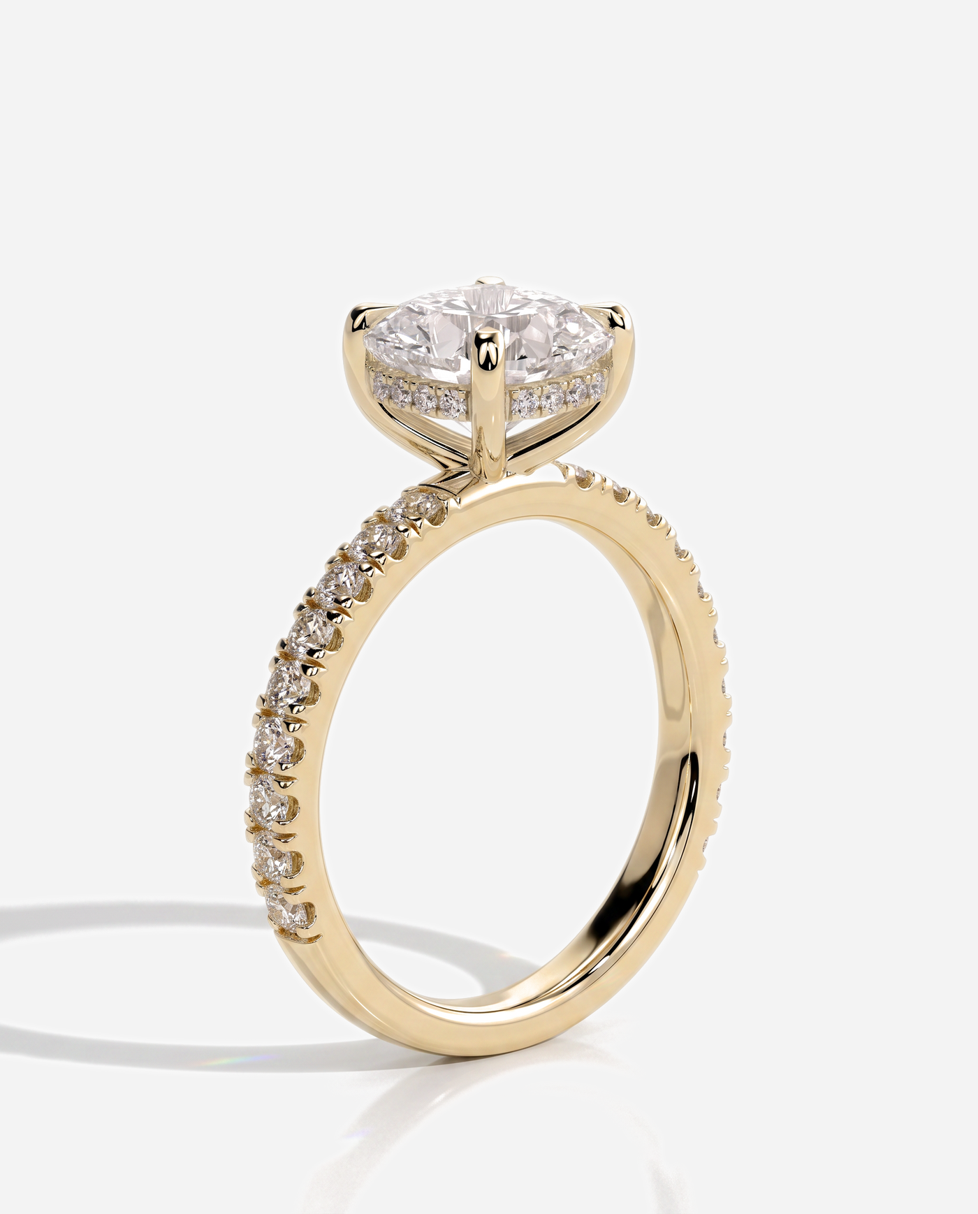 Cadence Cushion Claw Solitaire with Hidden Halo and Pave Band Engagement Ring, lab grown diamond in yellow gold, three quarter view