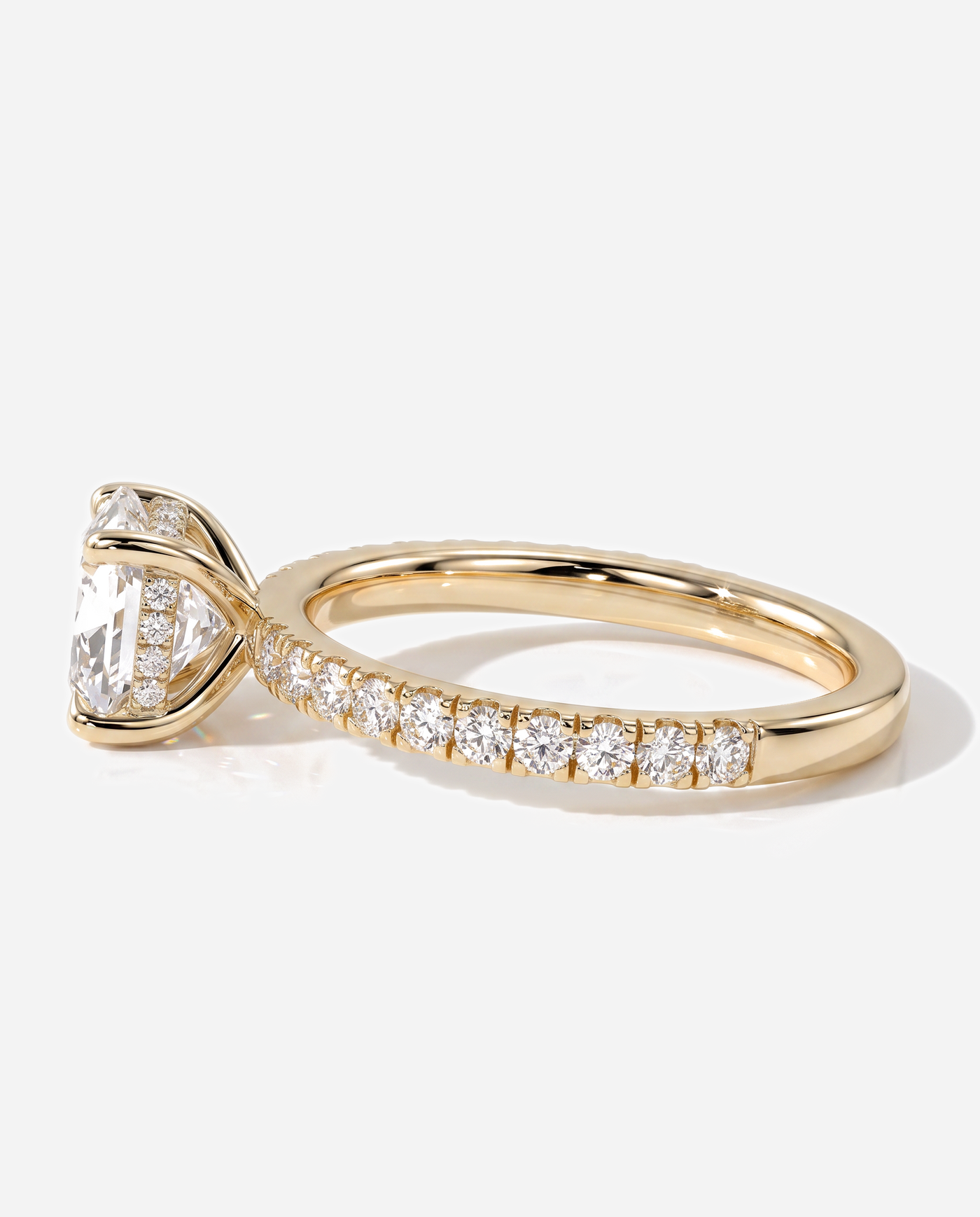 Cadence Cushion Claw Solitaire with Hidden Halo and Pave Band Engagement Ring, lab grown diamond in yellow gold, detail view