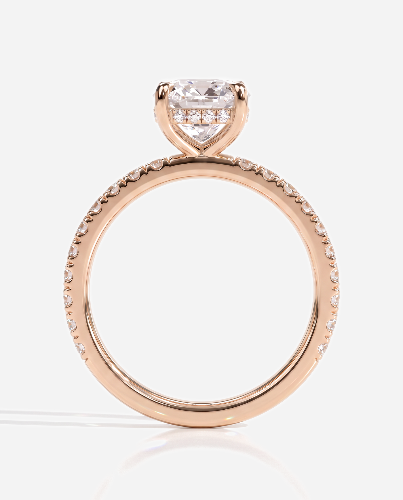 Cadence Cushion Claw Solitaire with Hidden Halo and Pave Band Engagement Ring, lab grown diamond in rose gold, side profile