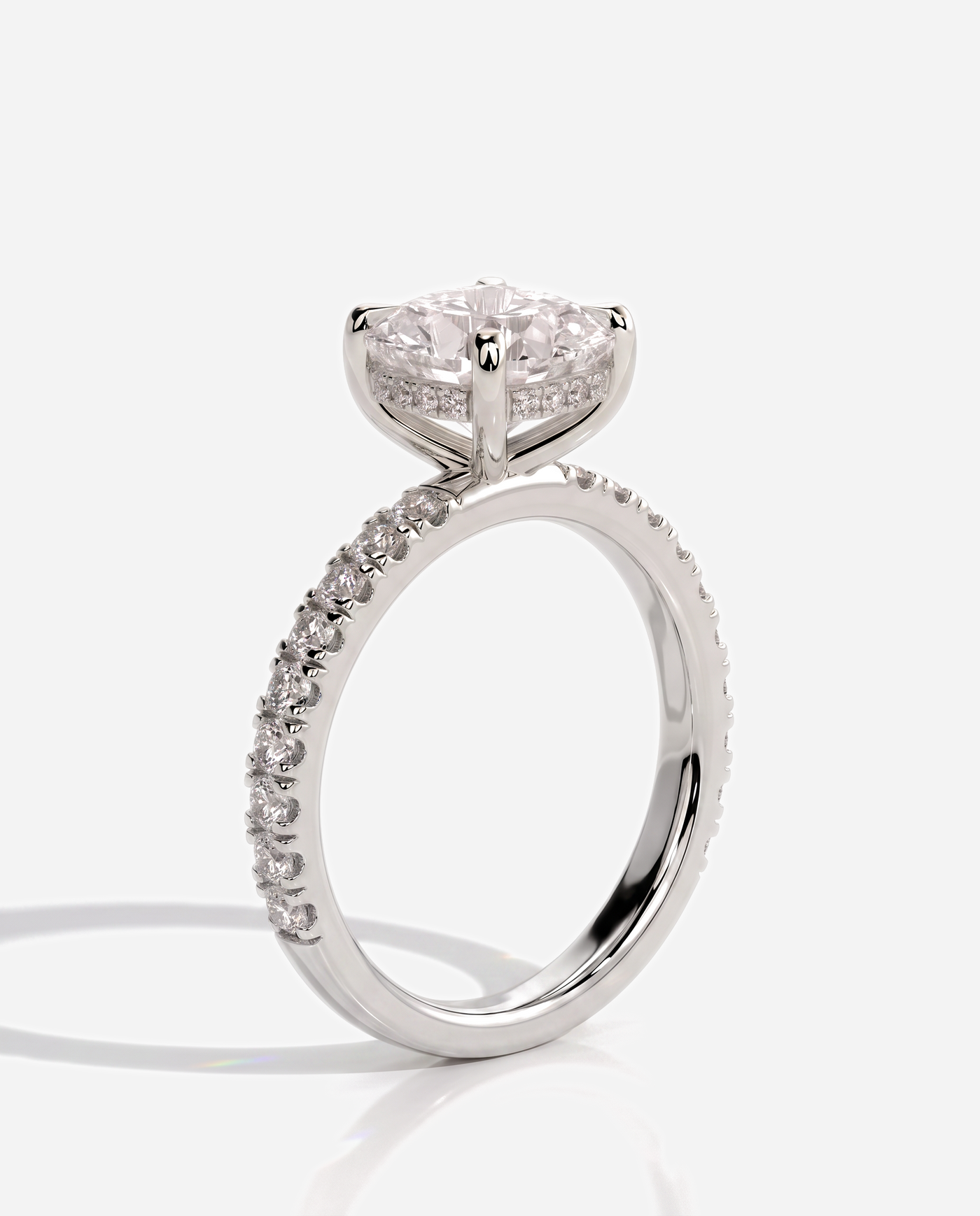 Cadence Cushion Claw Solitaire with Hidden Halo and Pave Band Engagement Ring, lab grown diamond in white gold, three quarter view