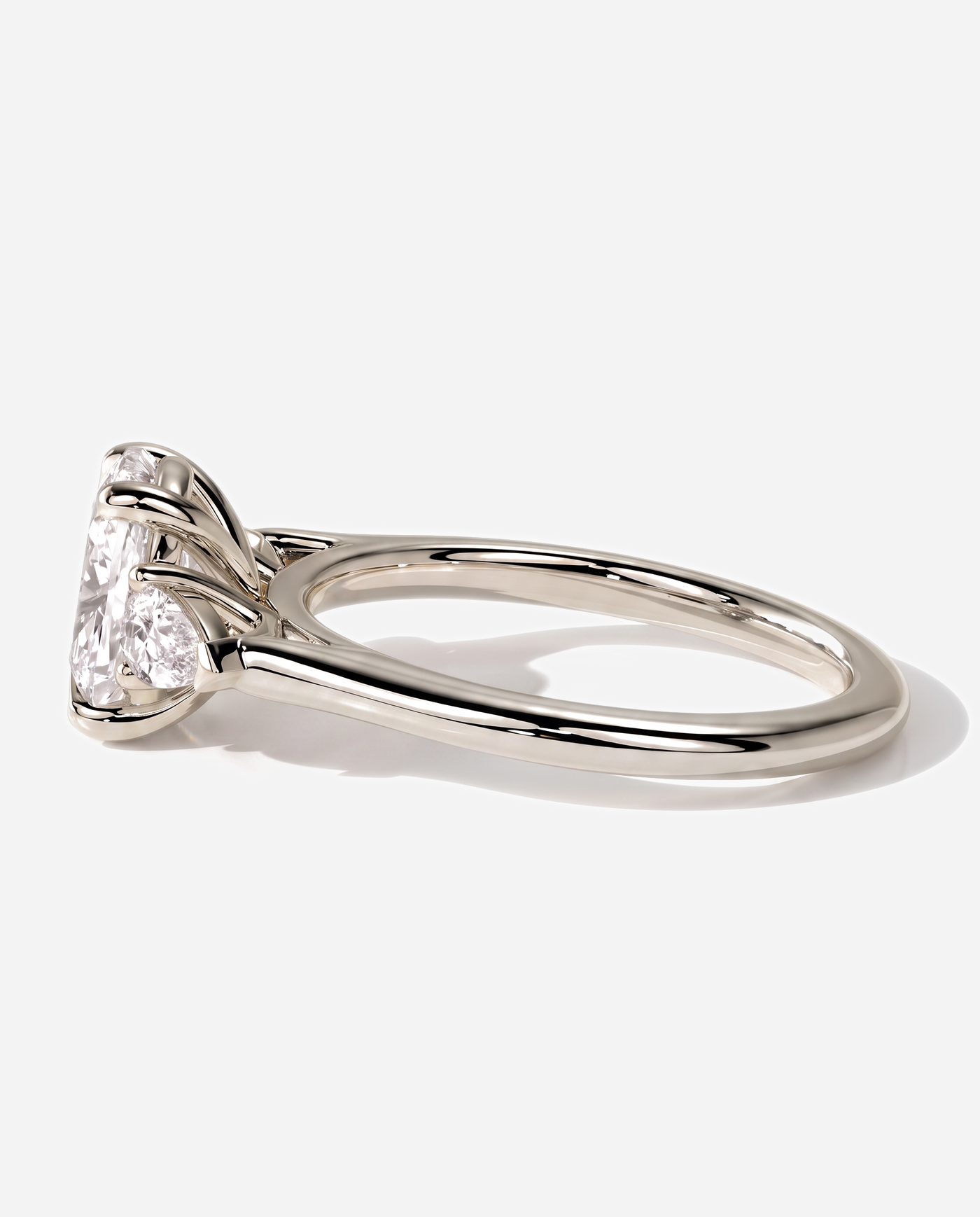 Quinn Elongated Cushion Claw Trilogy with Pear Side Stones and Cathedral Setting Engagement Ring, lab grown diamond in white gold, detail view