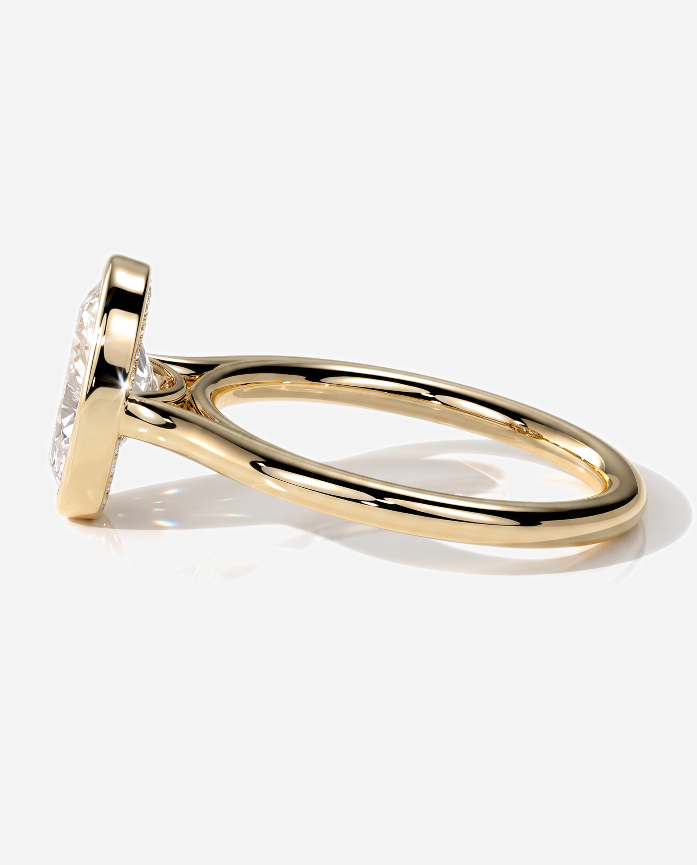Vesper Oval Bezel Solitaire with Cathedral Setting Engagement Ring, lab grown diamond in yellow gold, detail view